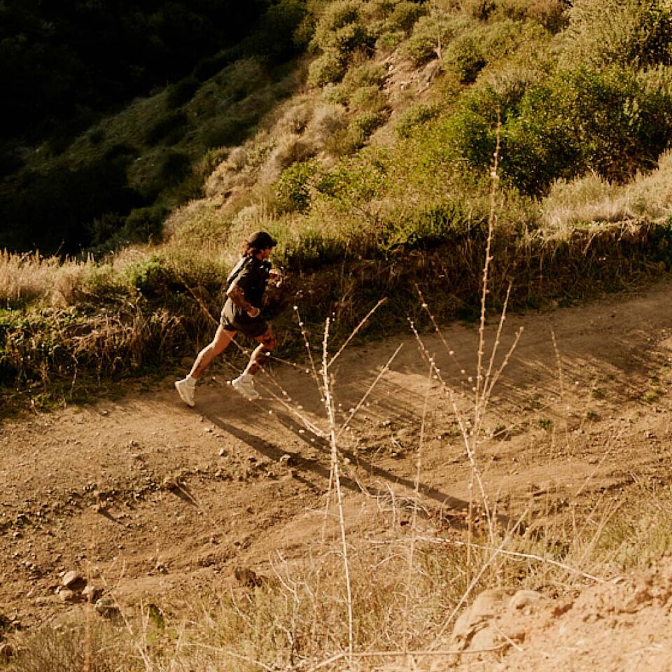 Trail runner using CamelBak hydration gear